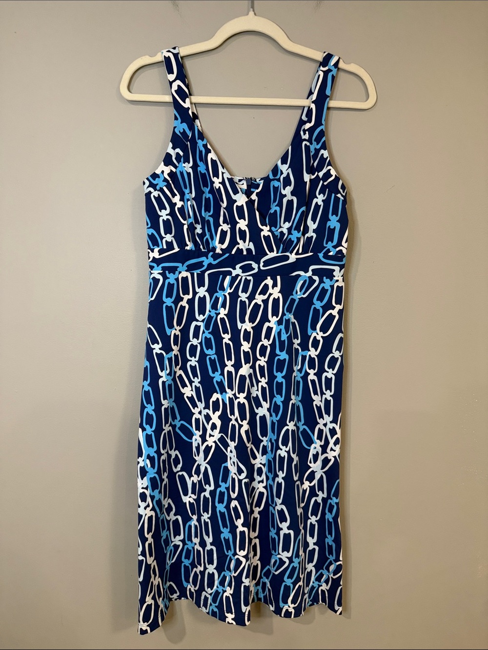 J McLaughlin navy sleeveless strap dress with white + blue chain pattern zip-up